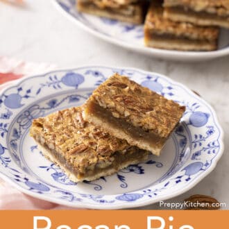 Pinterest graphic of two pecan pie bars stacked on a blue and white plate.