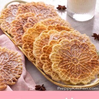 A pinterest graphic of Pizzelle cookies in a platter.