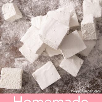Pinterest graphic of an overhead view of several cubed marshmallows made with this marshmallow recipe stacked on a cutting board.