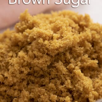 Pinterest graphic of a close up photo of brown sugar in a glass bowl.