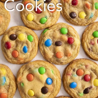 Pinterest graphic of several M&M Cookies on a counter in a grid configuration.