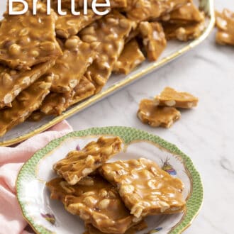 Pinterest graphic of pieces of peanut brittle stacked on a porcelain plate.