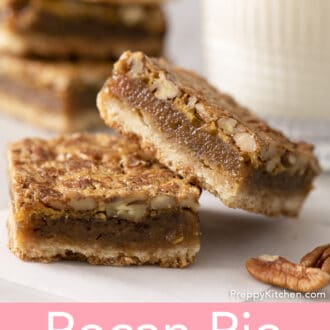 Pinterest graphic of 2 pecan pie bars on a counter with a glass of milk.