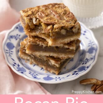 Pinterest graphic of 3 pecan pie bars stacked on a blue and white plate.