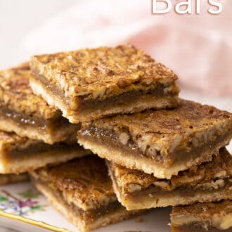 Pinterest graphic of pecan pie bars stacked on a serving tray.