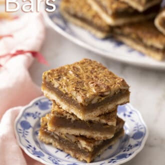 Pinterest graphic of pecan pie bars stacked on a blue and white plate.