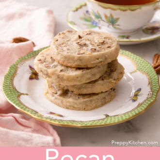 several pecan sandies stacked on a plate