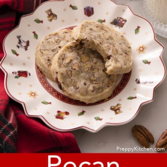 pecan sandies stacked on a christmas plate