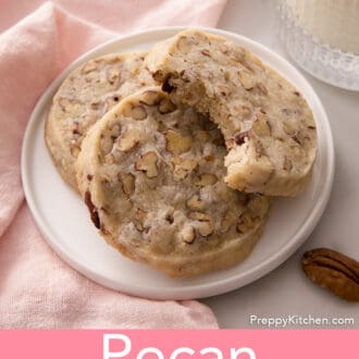 pecan sandies stacked on a white plate