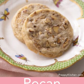 closeup image of pecan sandies stacked on a plate