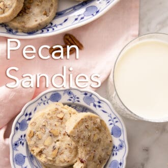 pecan sandies stacked on a blue and white plate