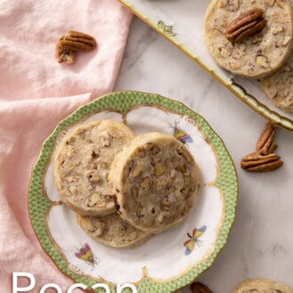 pecan sandies stacked on a plate