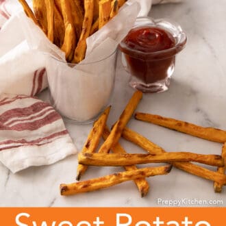 sweet potato fries in a cup with a side of ketchup