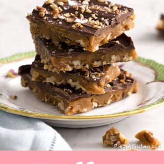 4 pieces of toffee stacked on a floral plate