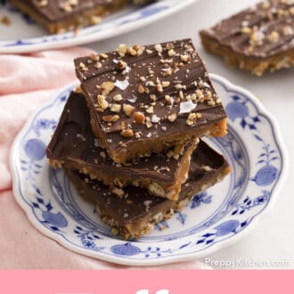 3 pieces of toffee stacked on a blue and white plate