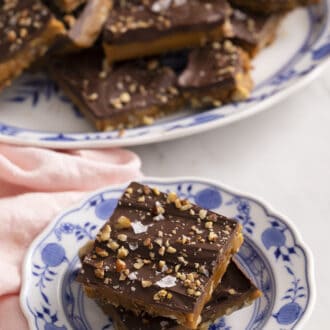 2 pieces of toffee on a blue and white plate
