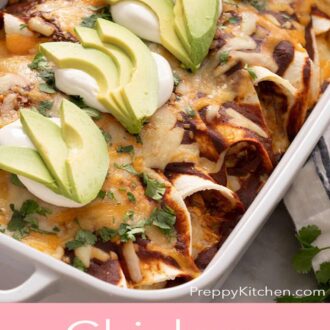 Pinterest graphic showing a casserole dish with enchiladas topped with sour cream and avocado.