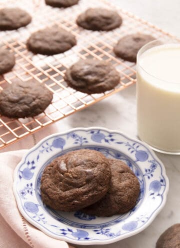 Two nutella cookies on a blue pattered plate