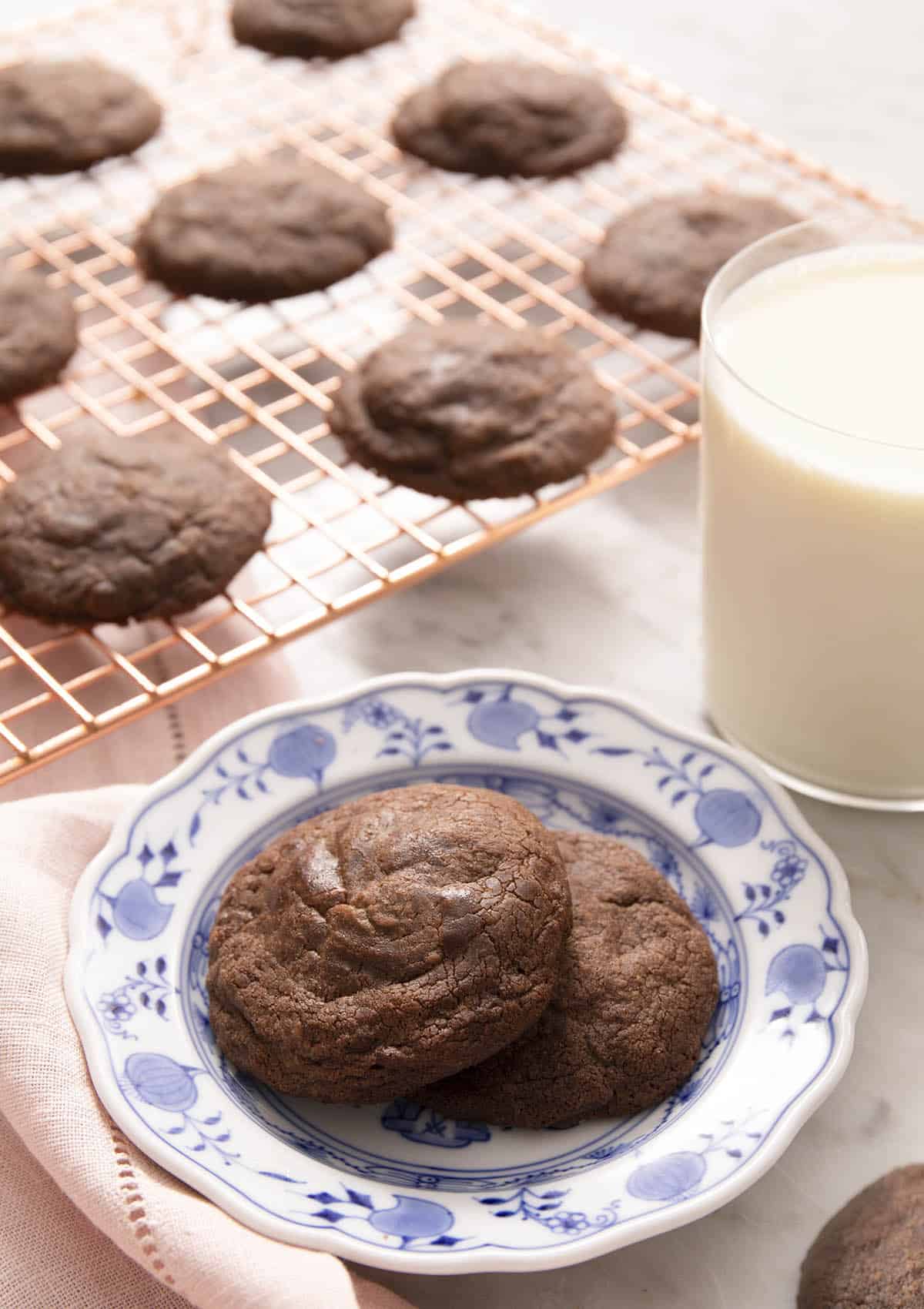 Two nutella cookies on a blue pattered plate