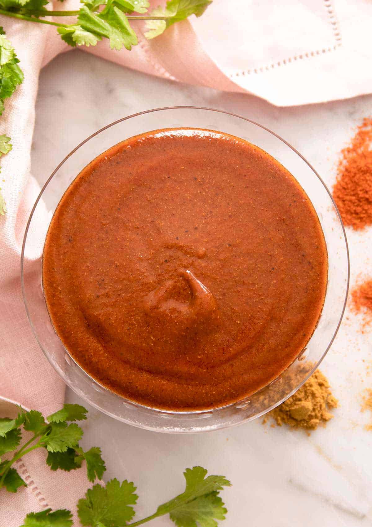 An overhead shot of enchilada red sauce in a bowl.
