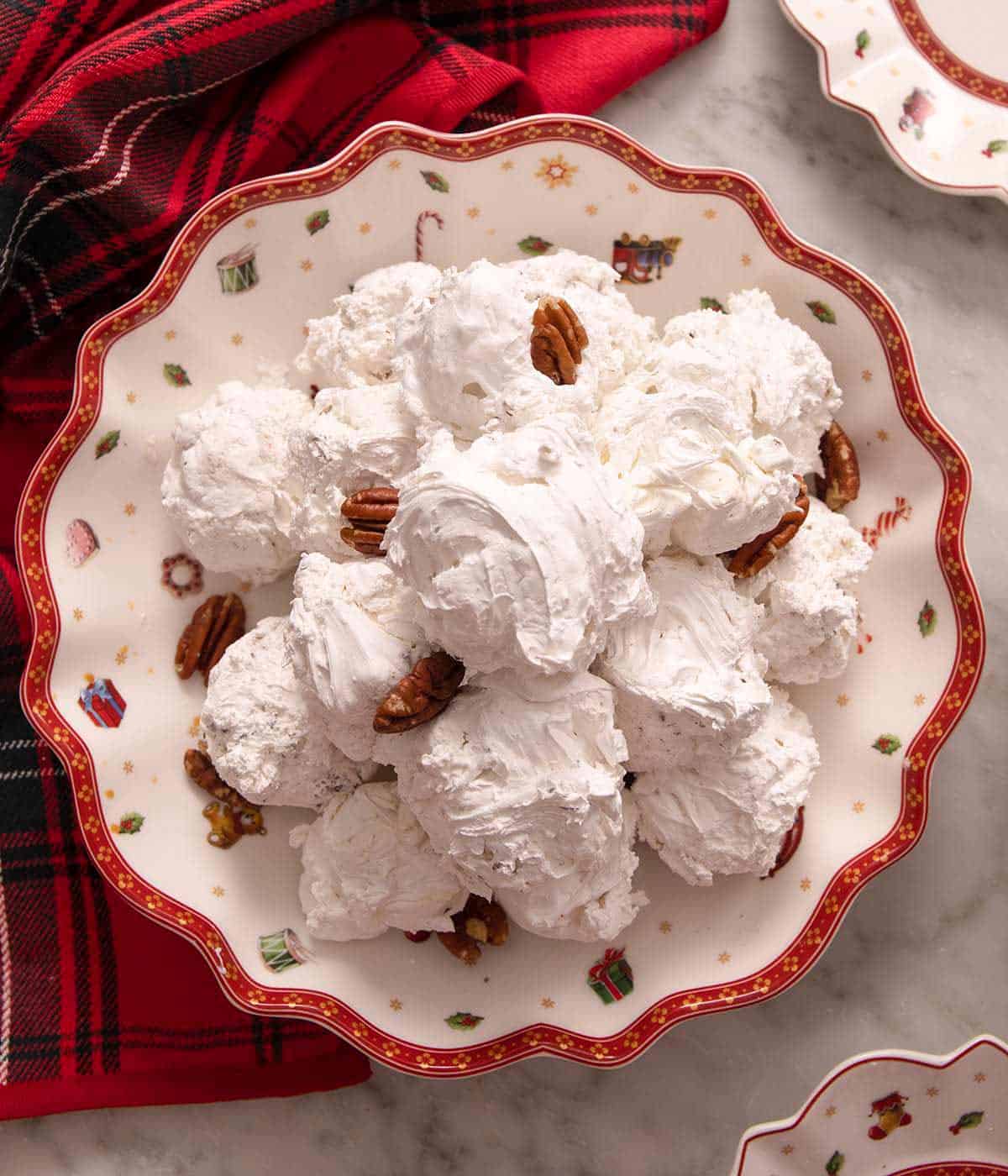 An overhead shot of Divinity candy in a festive plate with pecans.