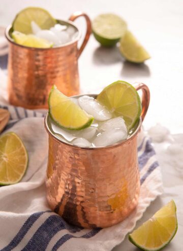 A side shot of a Moscow Mule cocktail in a copper mug