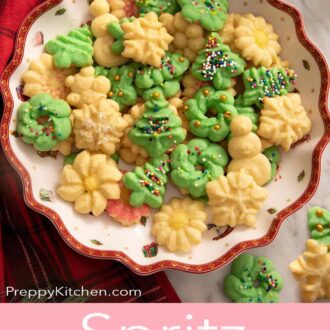 a platter full of various types of christmas themed spritz cookies