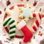 A close up of Christmas sugar cookies on a plate