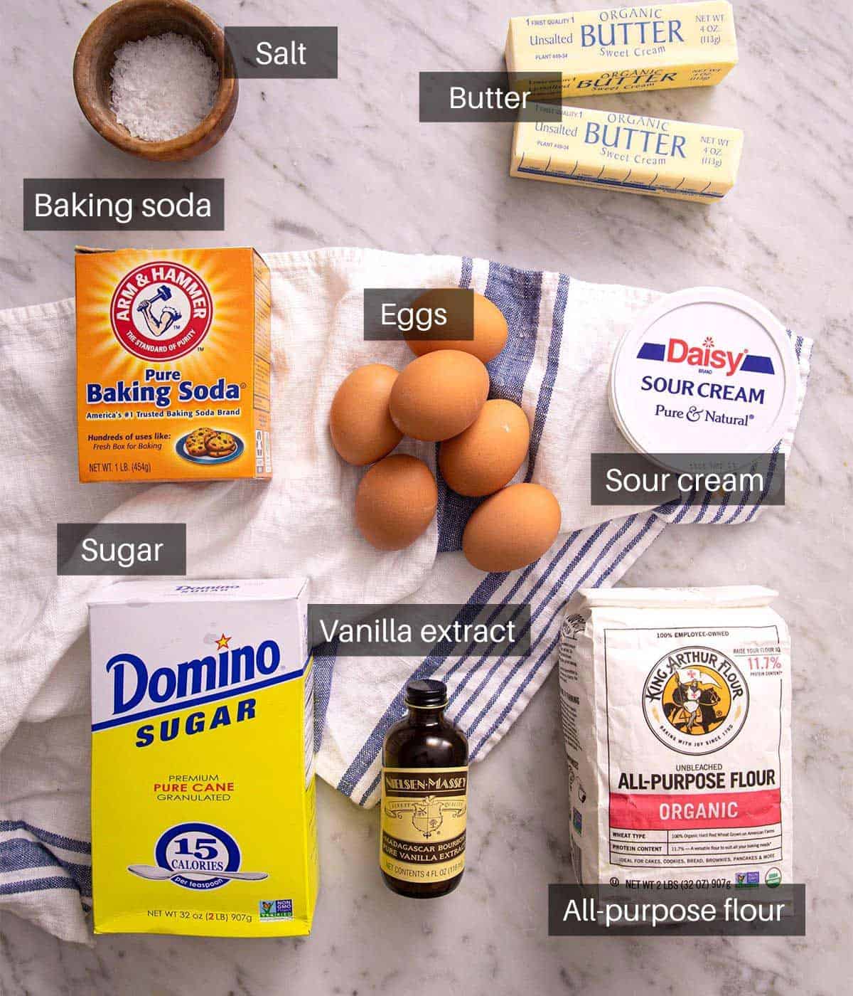 Ingredients needed to make a sour cream pound cake.