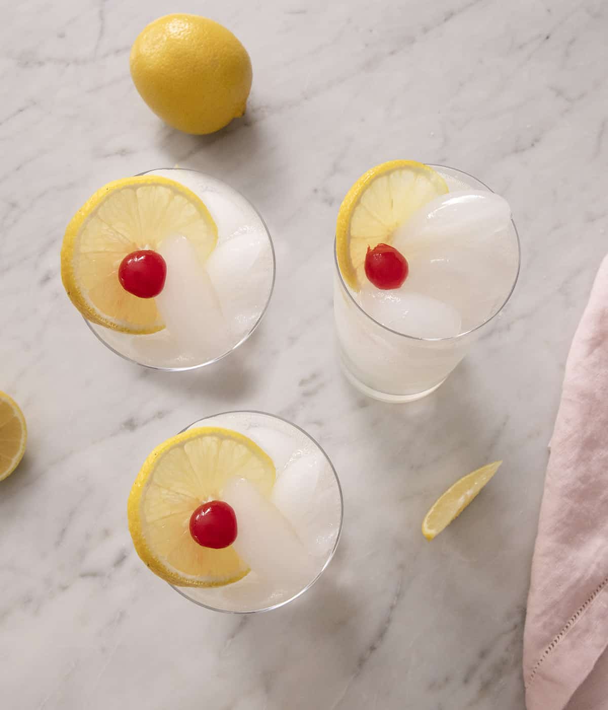 An overhead shot of three Tom Collins cocktails