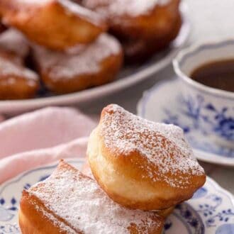 Pinterest graphic of a small patterned plate with a few beignets.