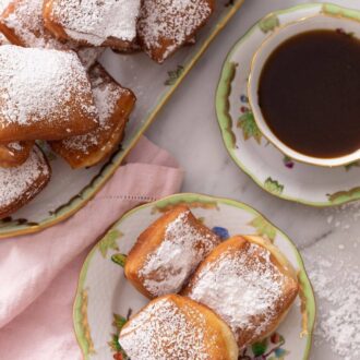 Pinterest graphics of an overhead shot of beignets: some on a small plate and the rest on a large platter.