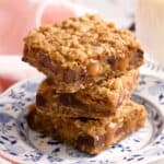 A close up of a stack of three carmelitas on a plate.