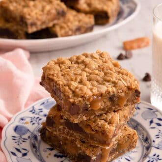 Pinterest graphic of a stack of carmelitas on a plate. A platter in the background.
