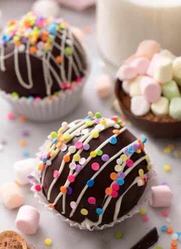 A hot chocolate bomb topped with sprinkles