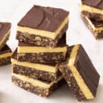 A close up of a stack of Nanaimo bars