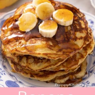A pinterest graphic of banana pancakes with maple syrup and sliced bananas on top.