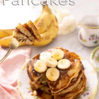 A pinterest graphic of a bite of banana pancakes lifted on a fork.