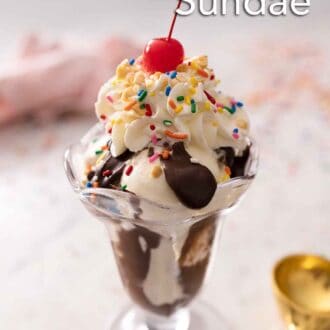 Pinterest graphic of a glass of vanilla ice cream topped with hot fudge, whipped cream, sprinkles, and a cherry.