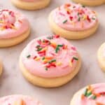Lofthouse cookies with sprinkles on a marble surface.