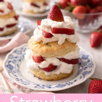 Pinterest graphic of a strawberry shortcake topped with whipped cream and strawberries on a blue and white plate.