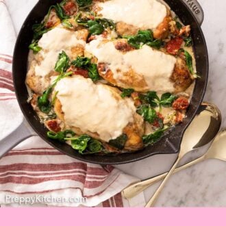 Pinterest graphic of a four chicken breasts covered in a creamy Tuscan chicken sauce.