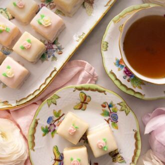 Pinterest graphic of a two rows of petit fours in a platter beside a serving plate with three and a cup of tea.