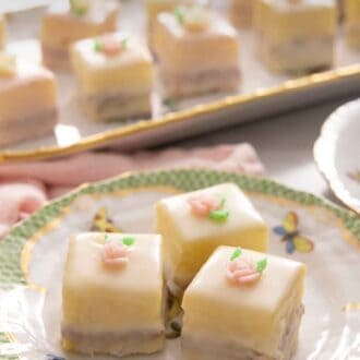 Pinterest graphic of three petit fours on a porcelain plate.