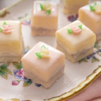 Pinterest graphic of petit fours on a serving platter beside a pink linen.