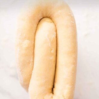 Pinterest graphic of a folded piece of puff pastry.