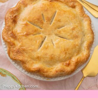Pinterest graphic of the overhead view of a baked turkey pot pie with 7 cuts on the crust, in a white pie dish.