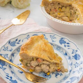 Pinterest graphic of a serving of turkey pot pie on a plate with gold colored serving utensils beside it.