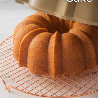 Pinterest graphic of a vanilla Bundt cake on a wire rack with the Bundt cake pan being removed.