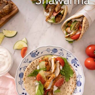 Pinterest graphic of three wrapped chicken shawarma with one on a plate, with the pita opened.